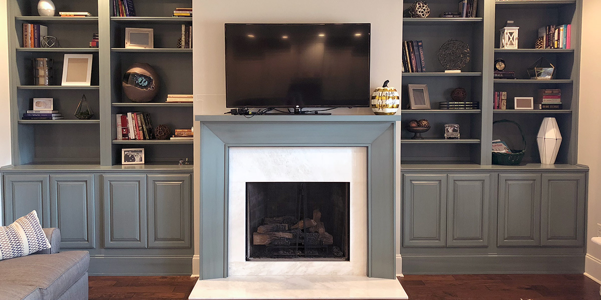 image of custom fireplace mantle with cabinets and bookshelves